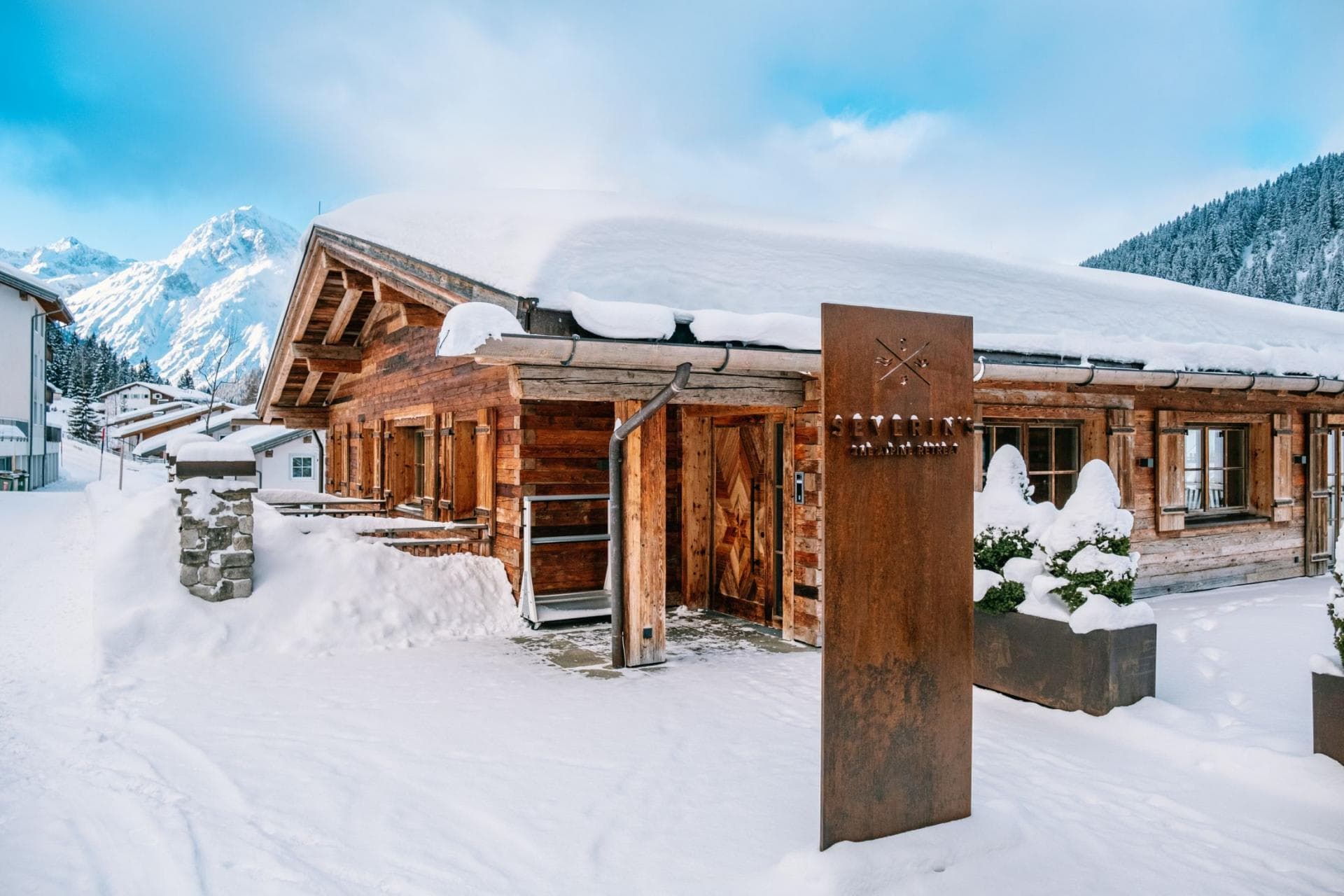 Chalet entrance with ski-in access and views of the Arlberg mountains