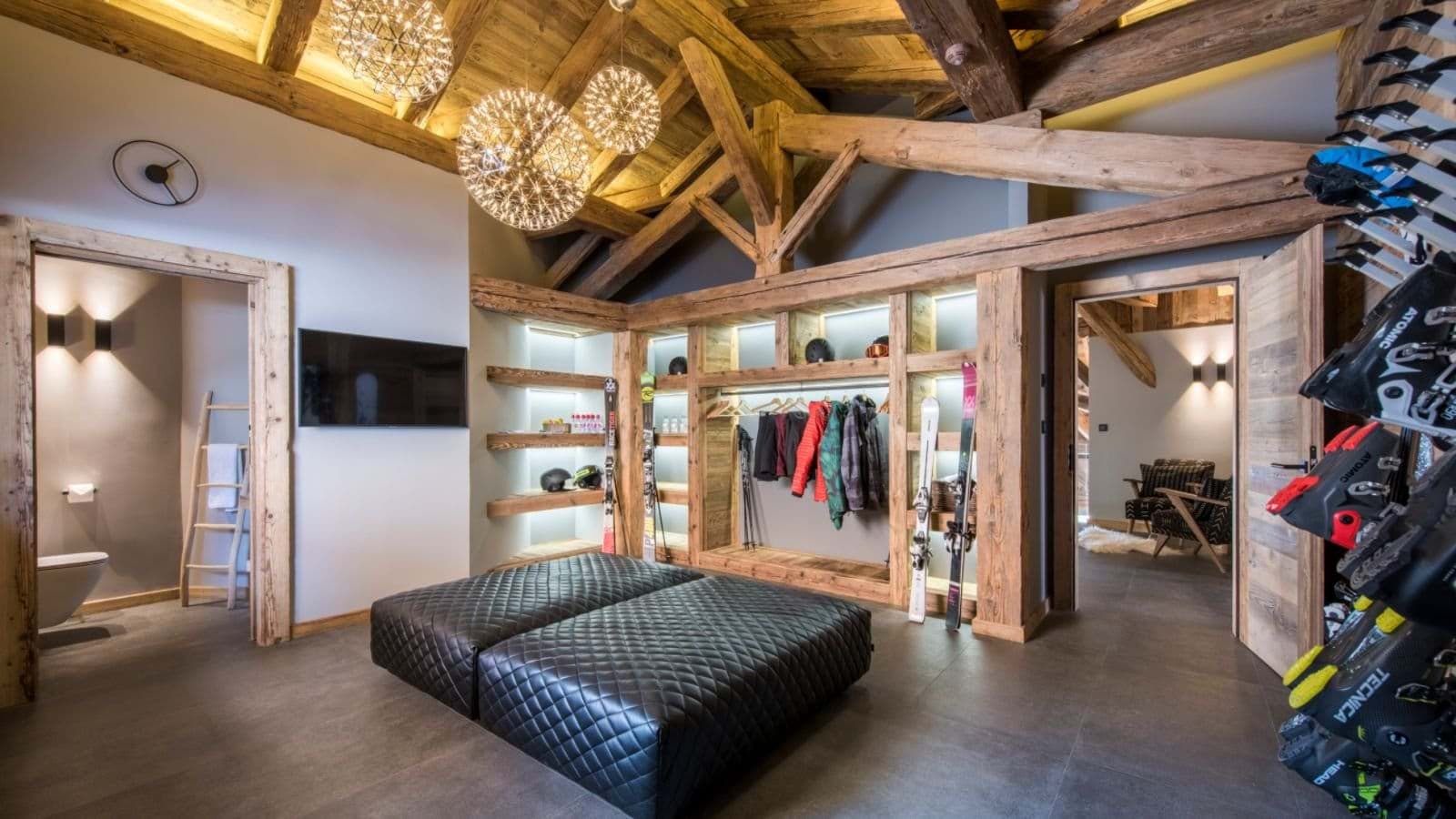 Ski room with heated boot racks and integrated gear storage