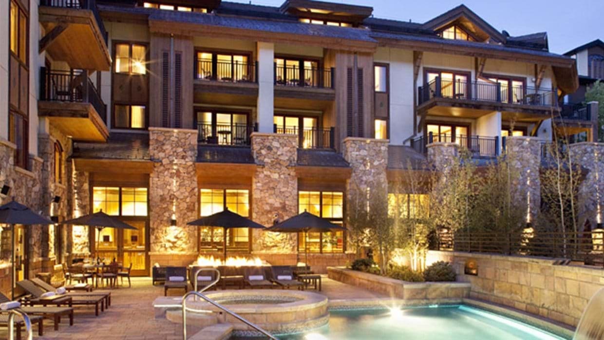 Shared patio with heated pool, hot tub, and gas fire pit