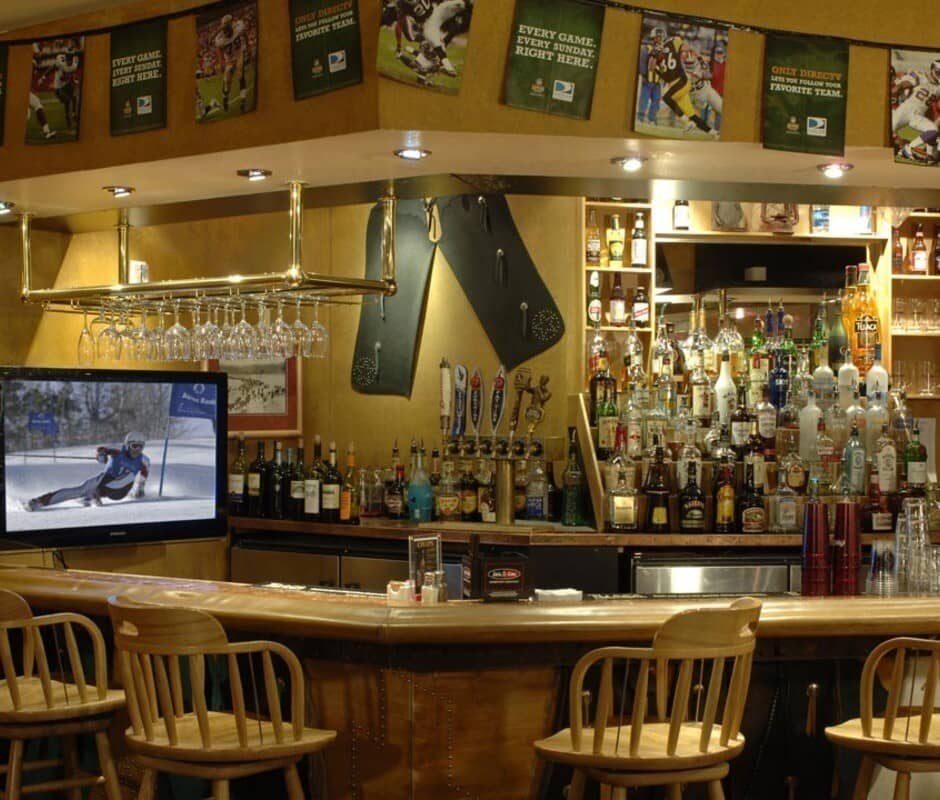Full bar featuring six draught beer taps and bar stool seating