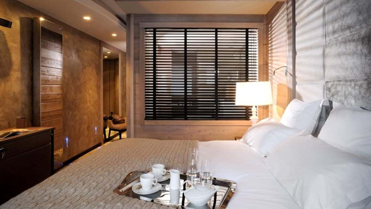 primary bedroom with king bed and integrated floor-level lighting