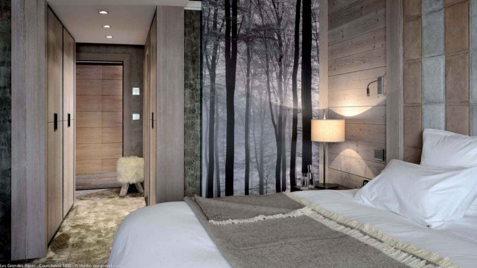 Primary bedroom with king bed and built-in wardrobe storage