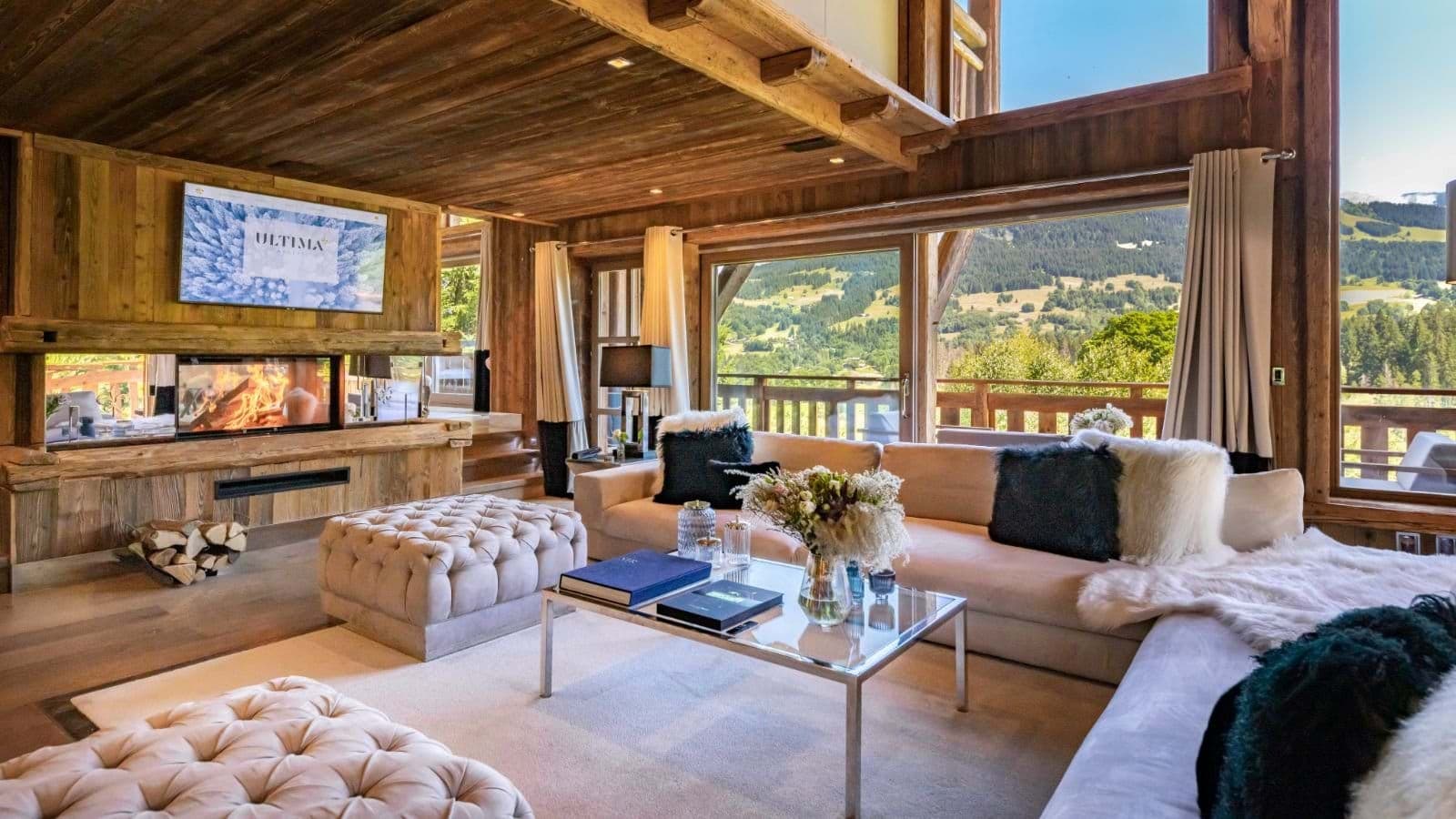 Living area with wood-burning fireplace and mountain valley views