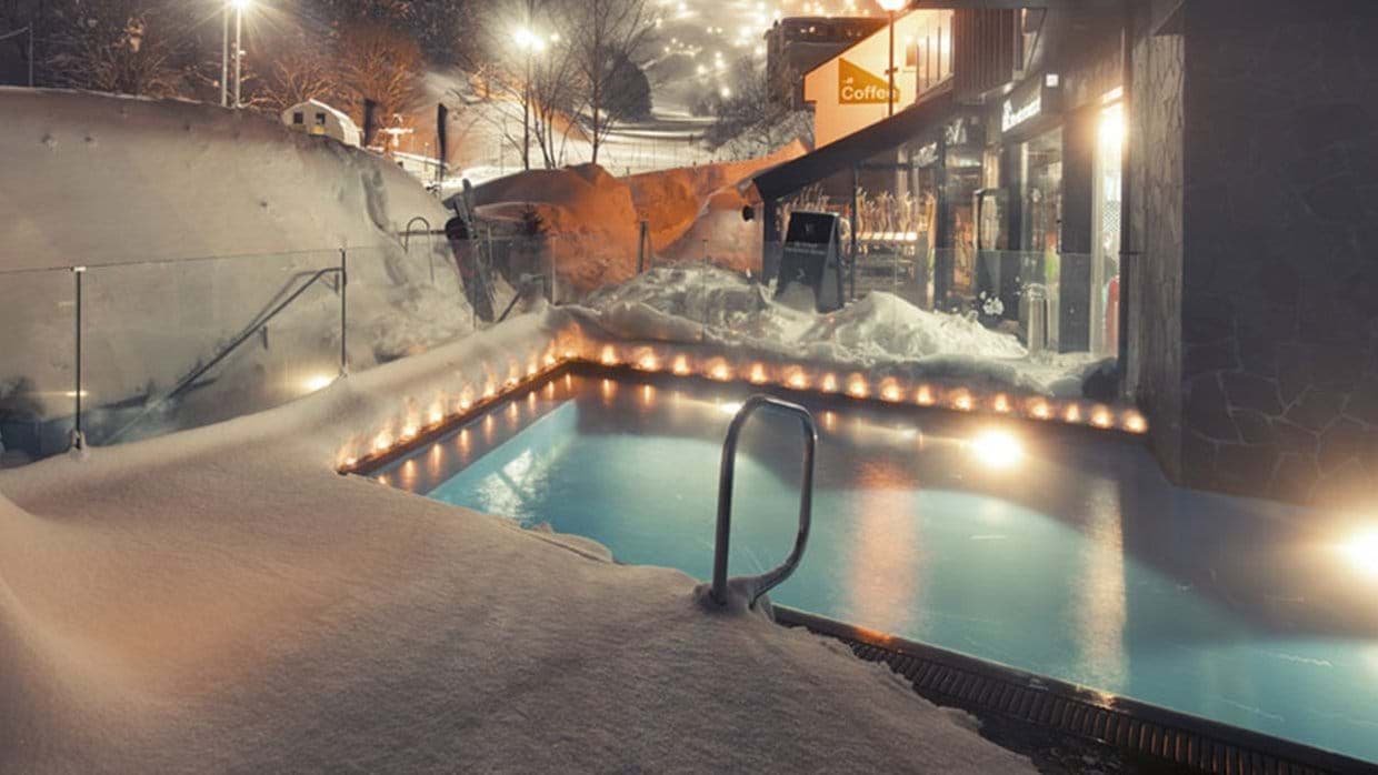 Heated outdoor pool with mountain views and ski-in/ski-out access