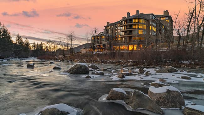 Riverside lodge exterior with direct access to Eagle River