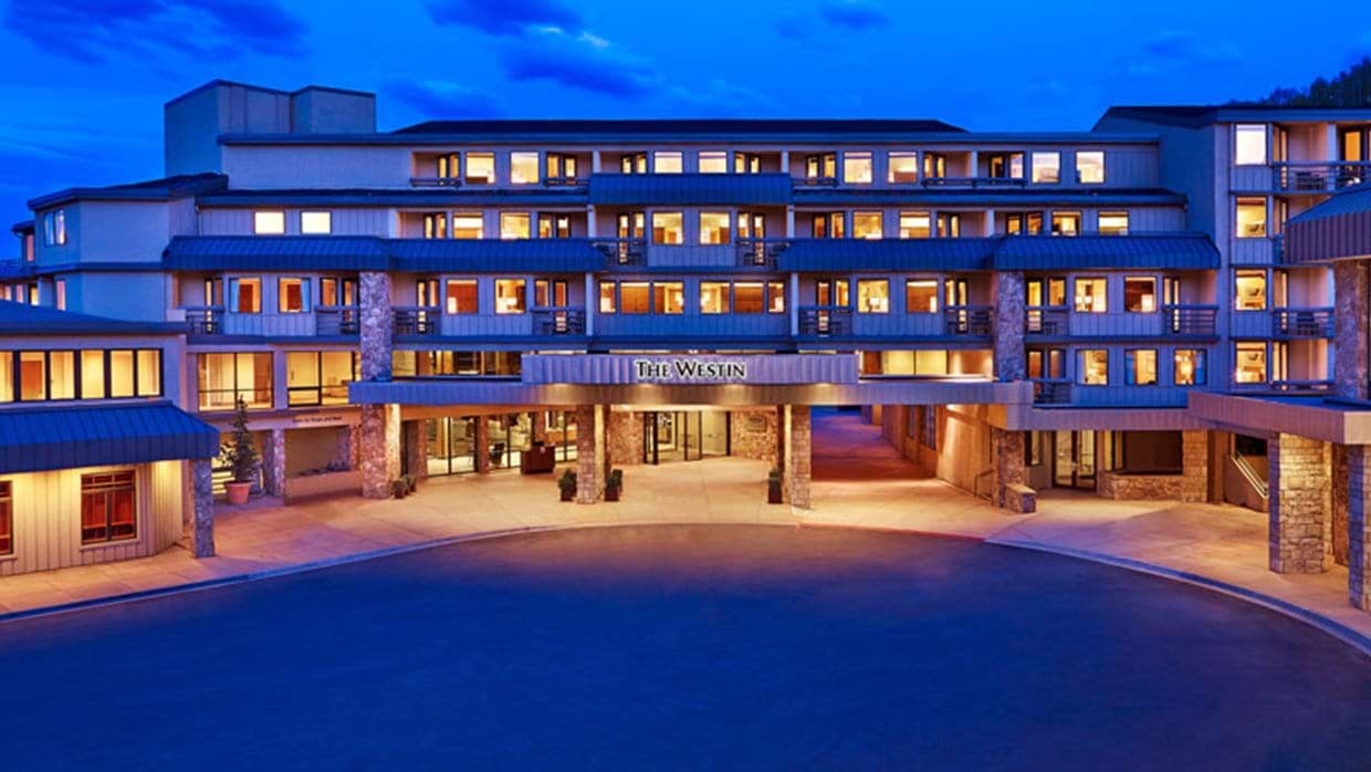 Building exterior with covered guest drop-off and circular driveway