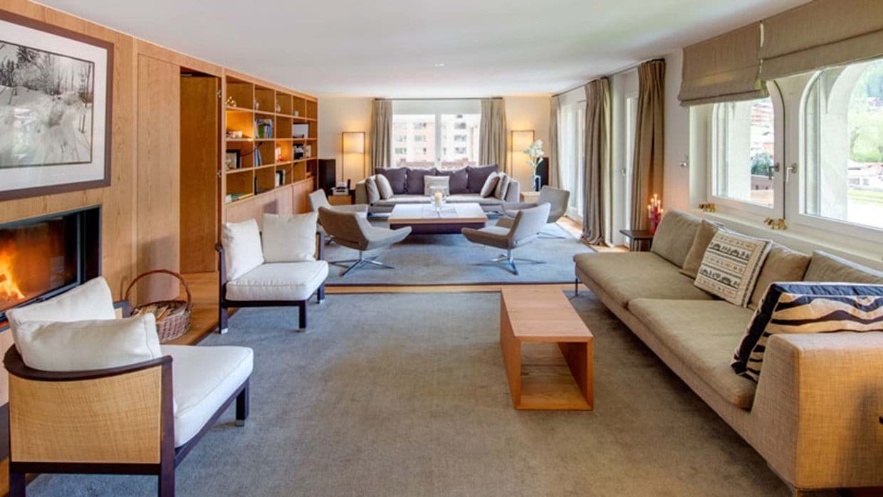 Living area with wood-burning fireplace and seating for 12