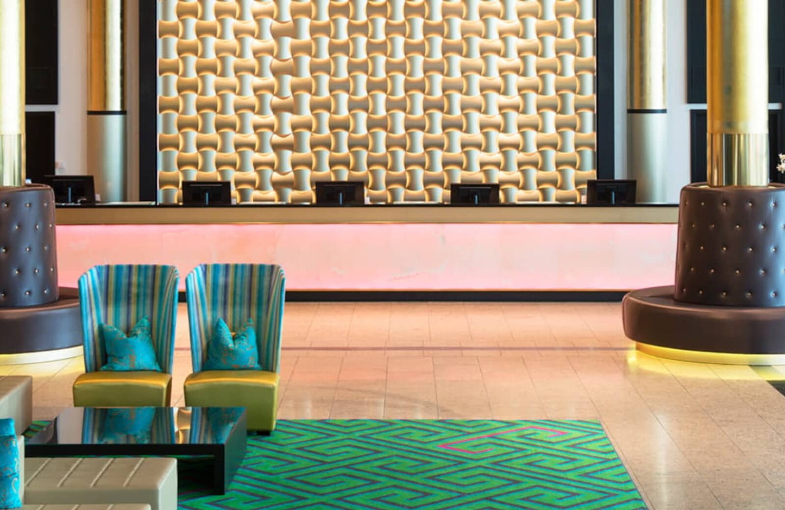 Lobby reception area with 24-hour concierge desk and lounge seating