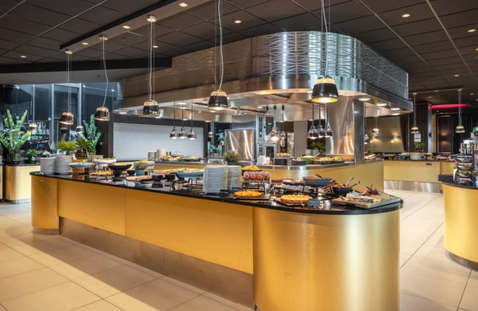 Buffet dining area with open kitchen and heat lamp stations