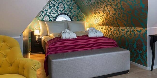 Attic bedroom with queen bed and vaulted ceilings