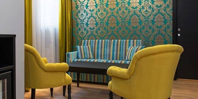 Sitting area with sofa bed and velvet armchairs