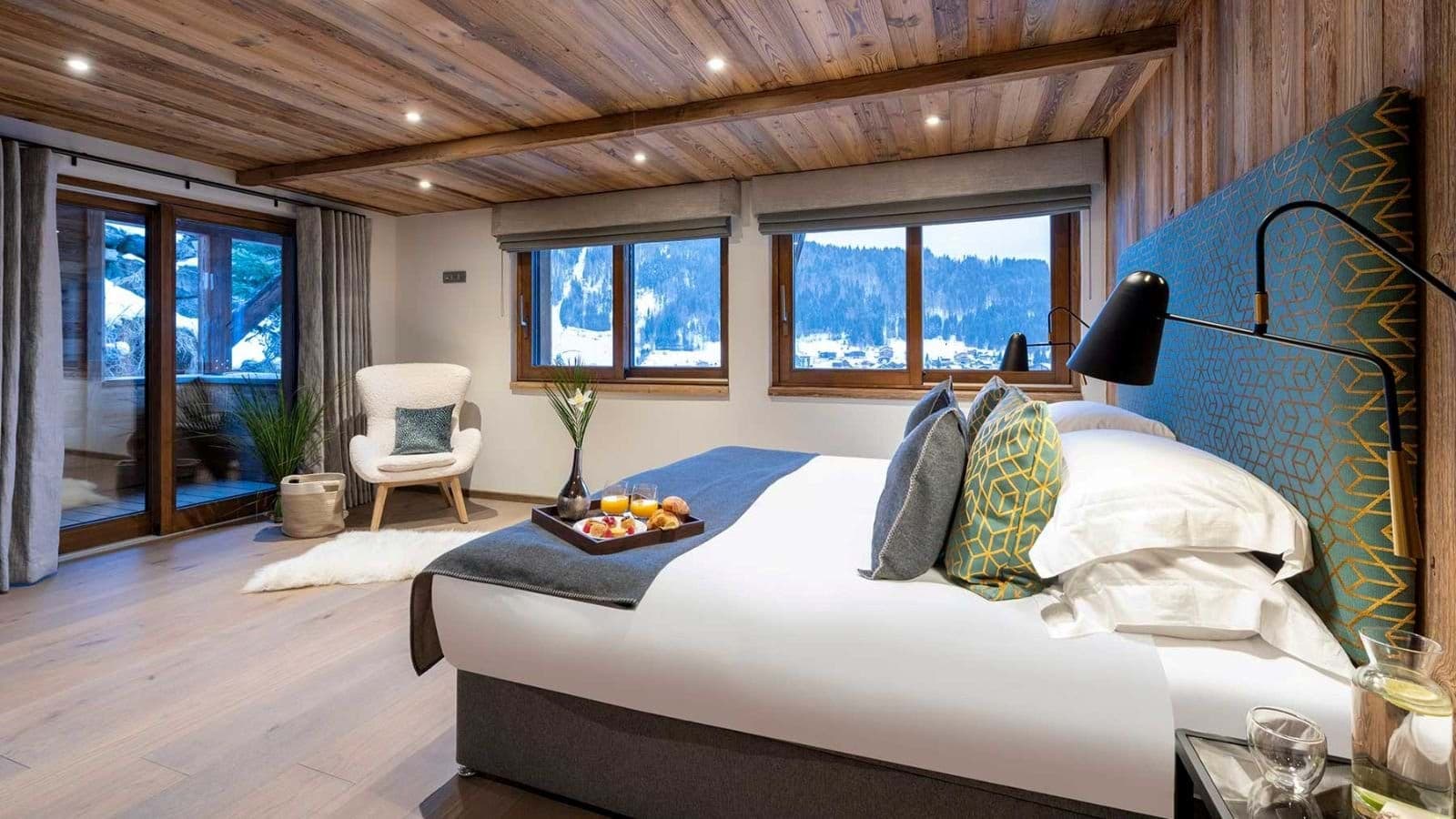 King bedroom with ski slope views and terrace access