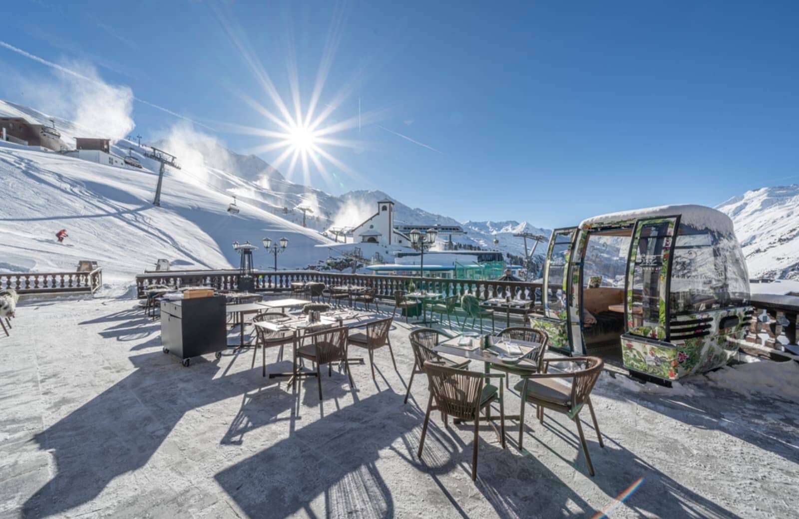 Ski-in/ski-out terrace with heated dining area and gondola seating