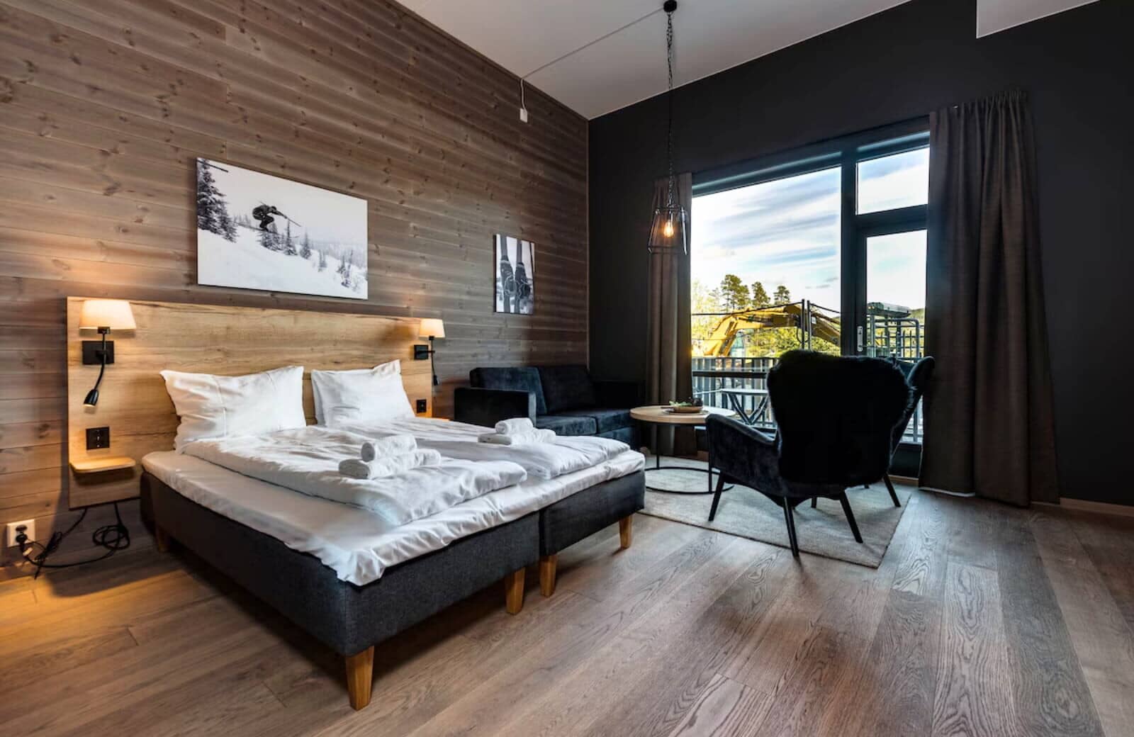 Studio with twin beds, seating area, and private balcony access