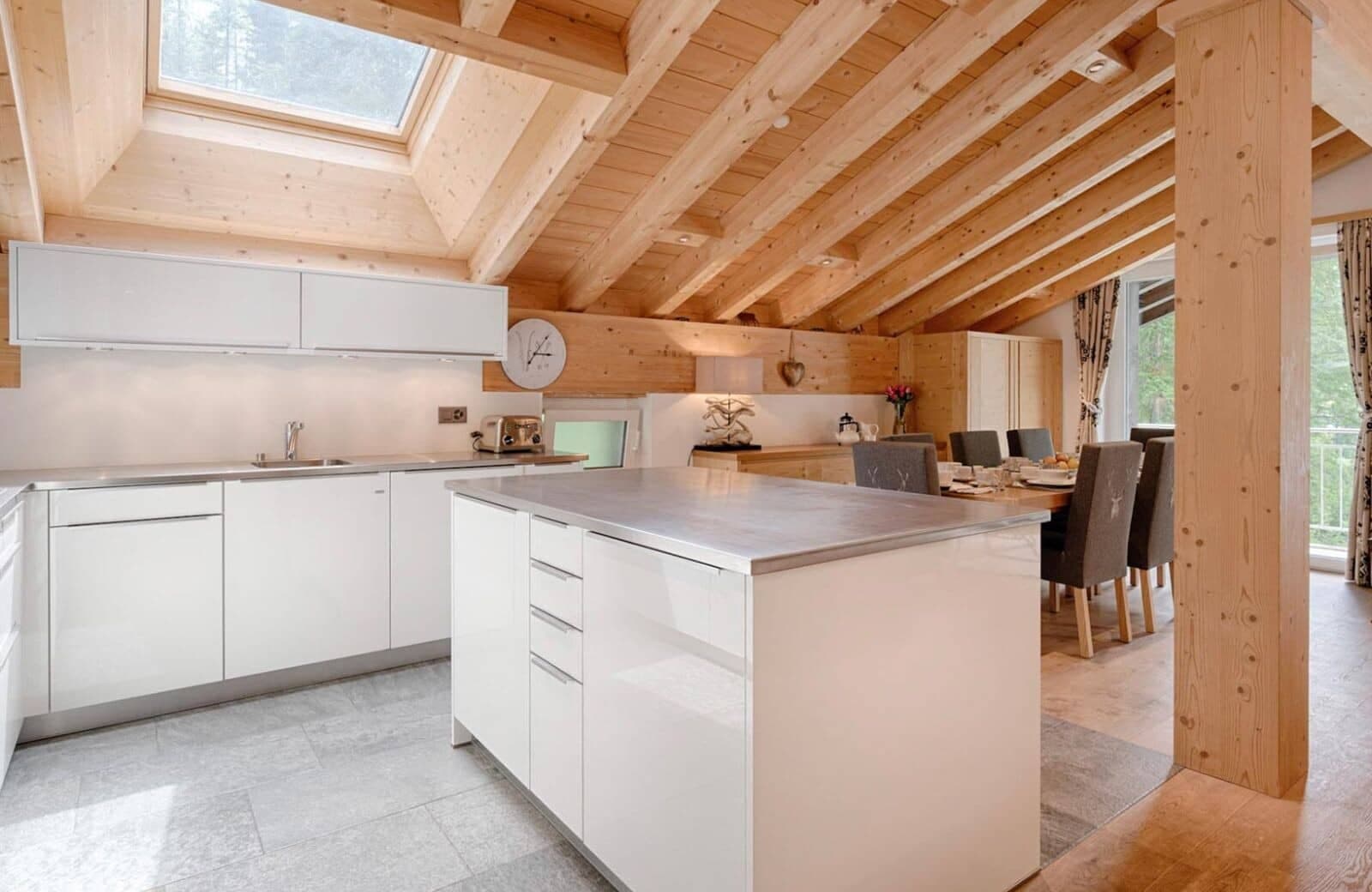 Kitchen with prep island and skylight; adjacent dining for 6