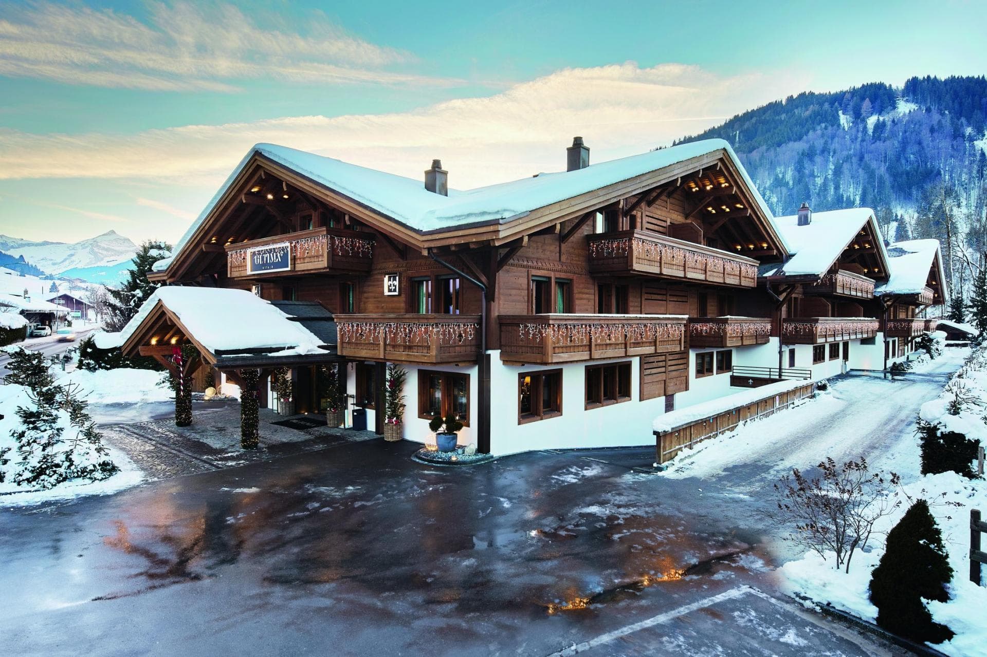 Chalet facade with tiered balconies and mountain views