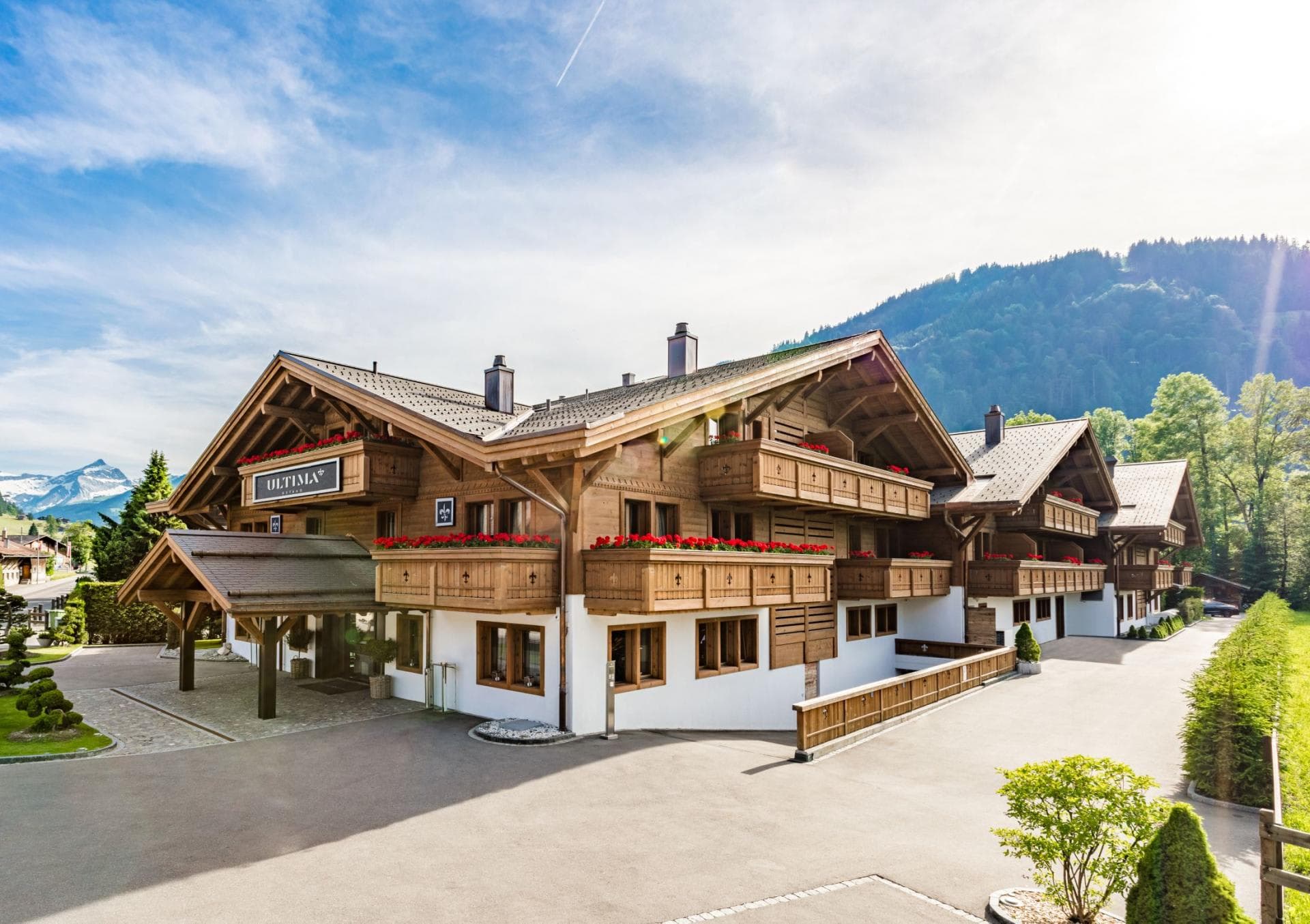 Chalet exterior with private balconies and covered entrance driveway