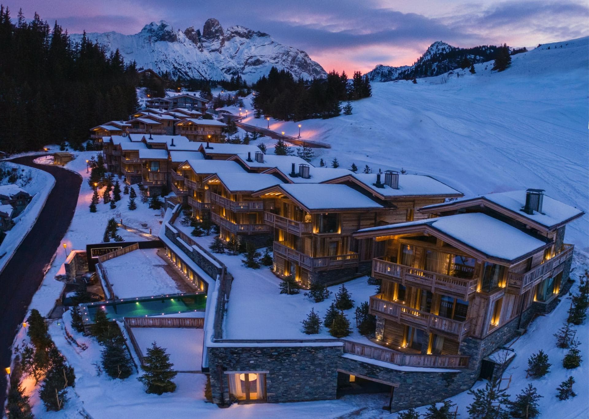 Ski-in/ski-out mountain chalets with heated outdoor pool and Dolomites views