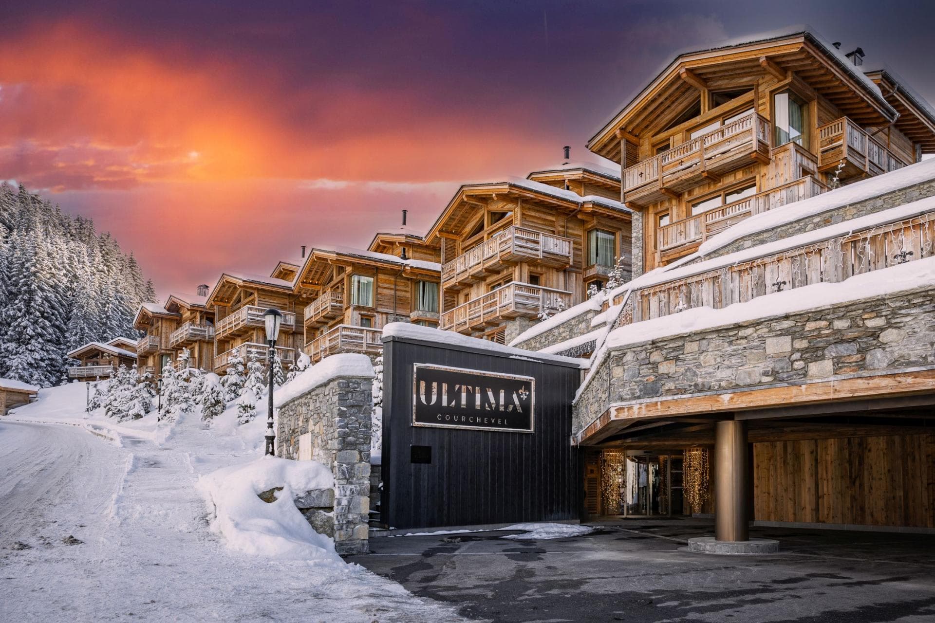 Ski-in, ski-out resort exterior with covered entrance and private balconies