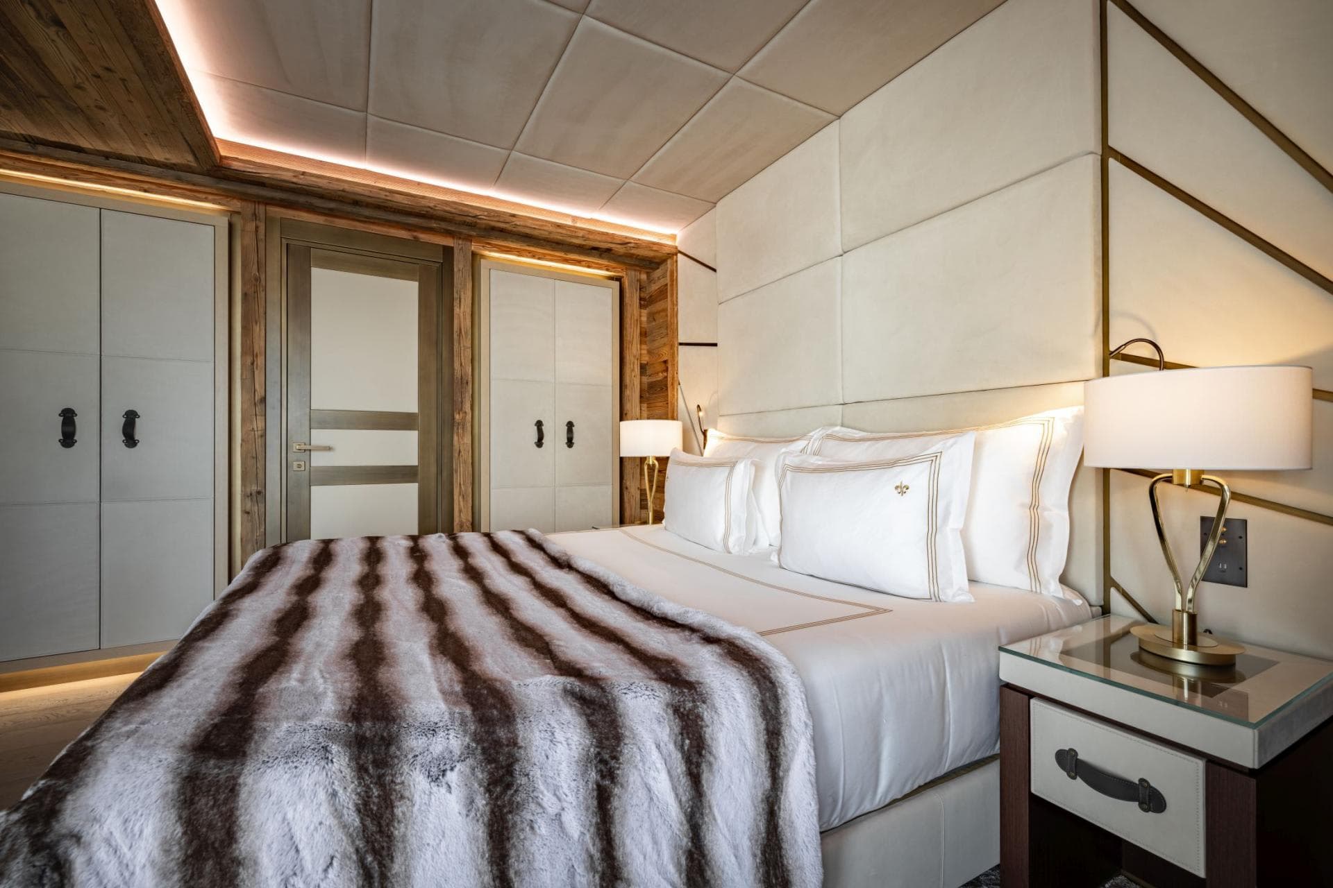 Guest bedroom with king bed and built-in wardrobe storage