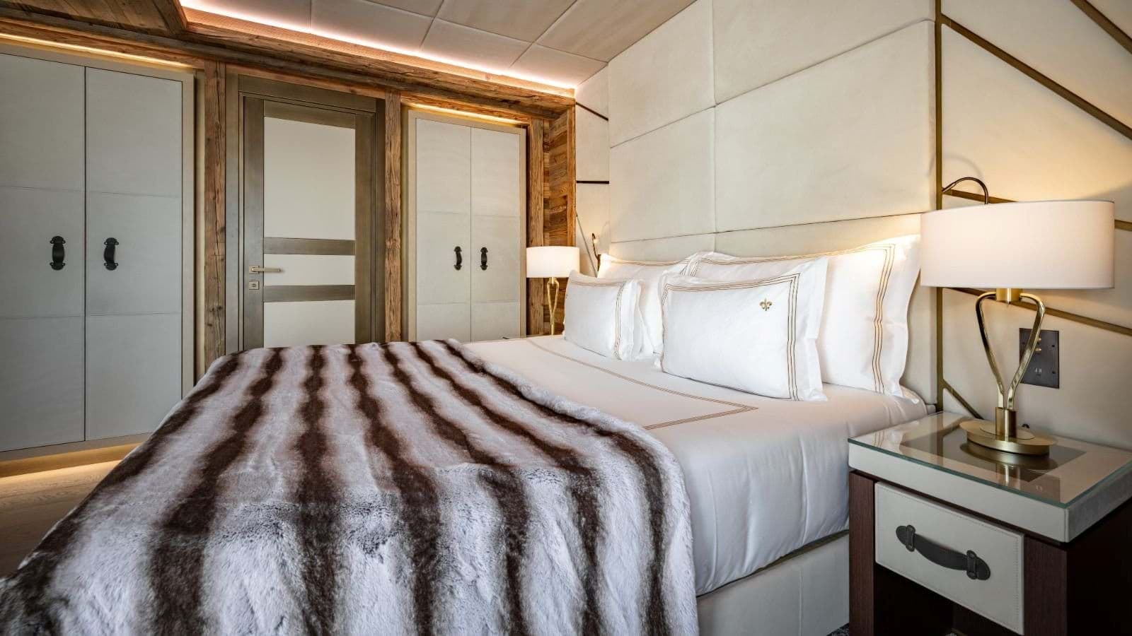 Bedroom with king bed and floor-to-ceiling built-in closets