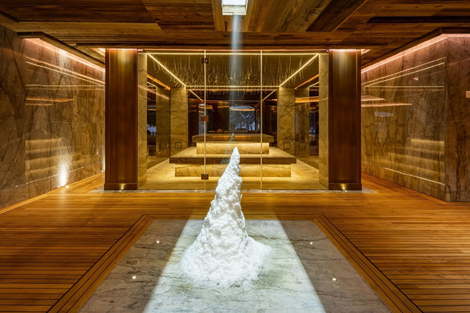 Spa wellness area featuring indoor snow room and heated stone benches