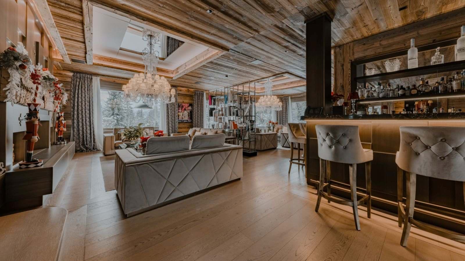 Open living area featuring full wet bar and wood-burning fireplace