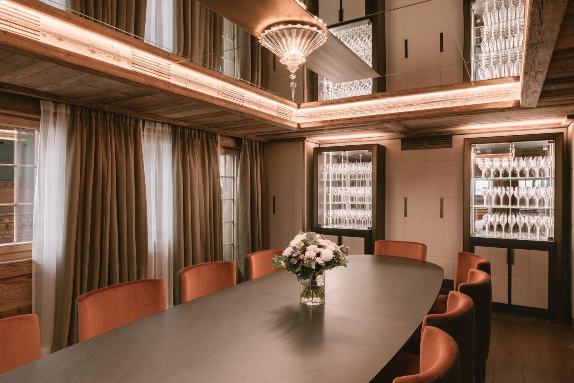 Dining area seats 10; mirrored ceiling and illuminated glass cabinets