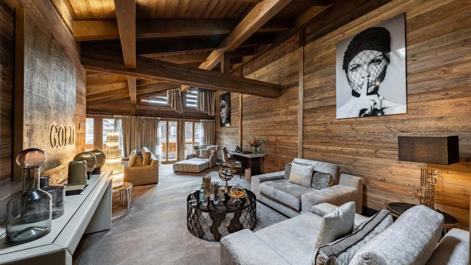 Living area with vaulted timber ceilings and dedicated workstation