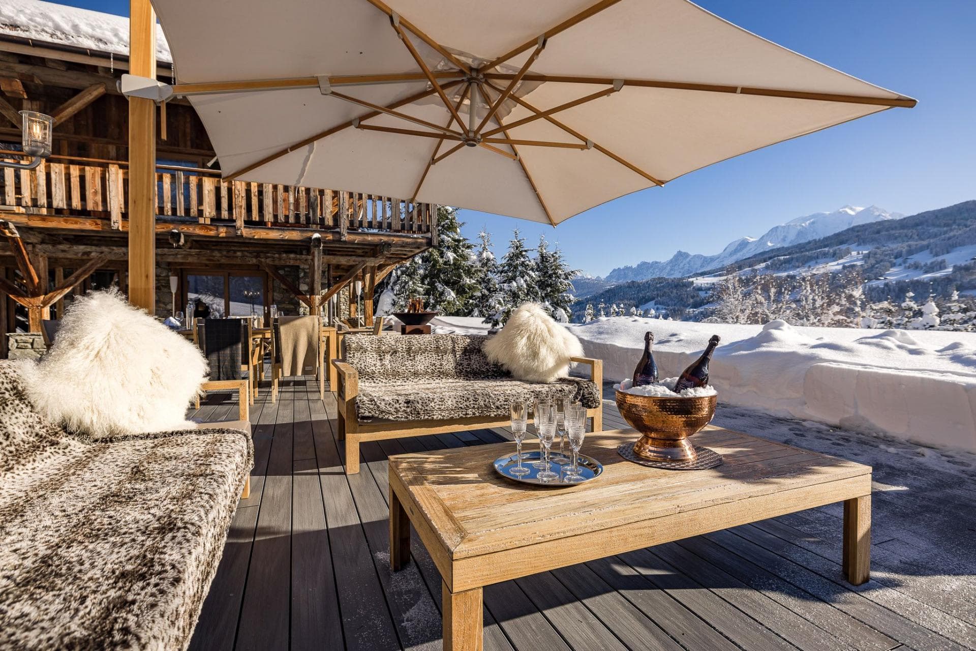 Lower deck with heated lounge seating and Mont Blanc views