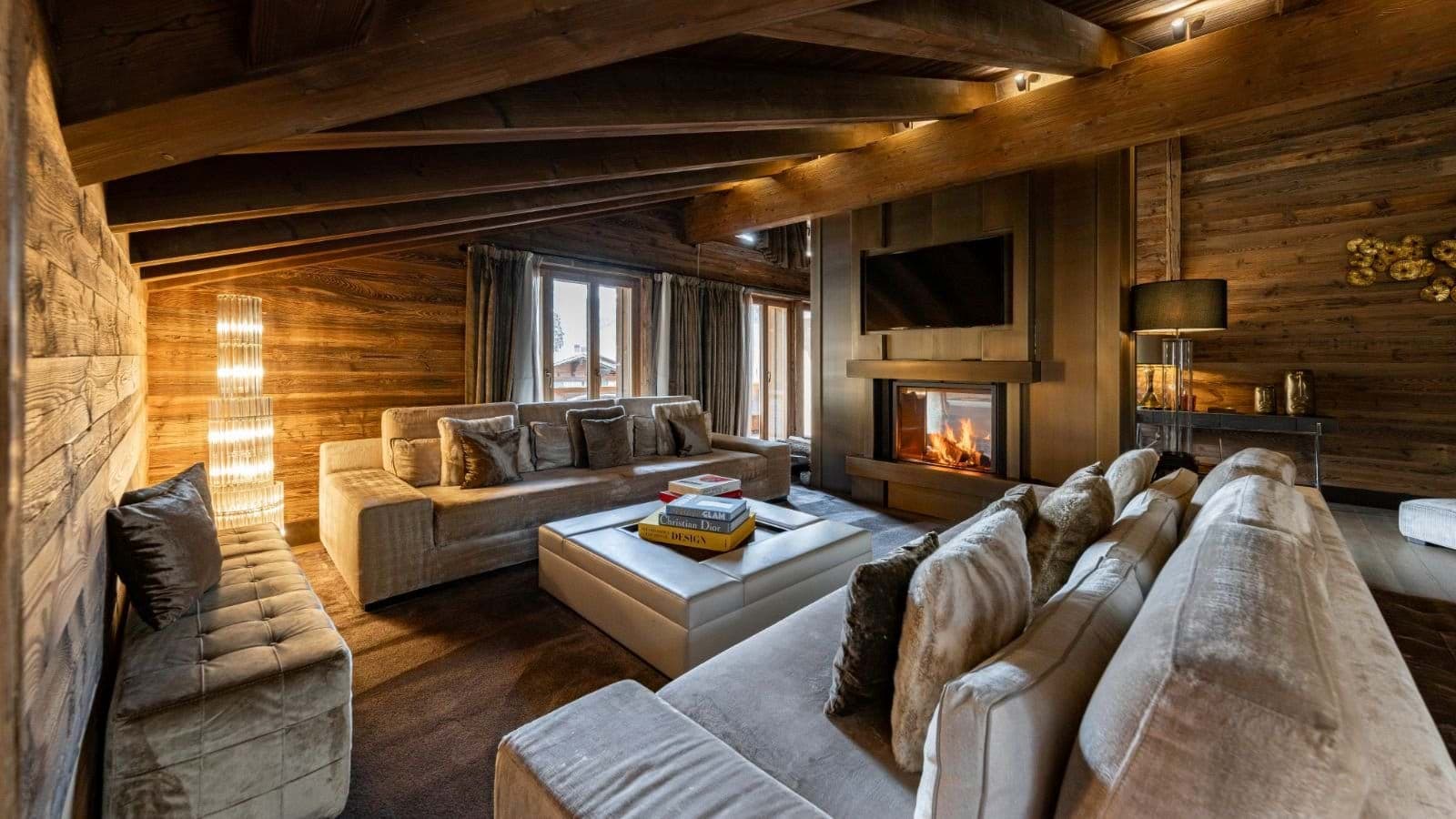 Living area with wood-burning fireplace and sectional seating for 10