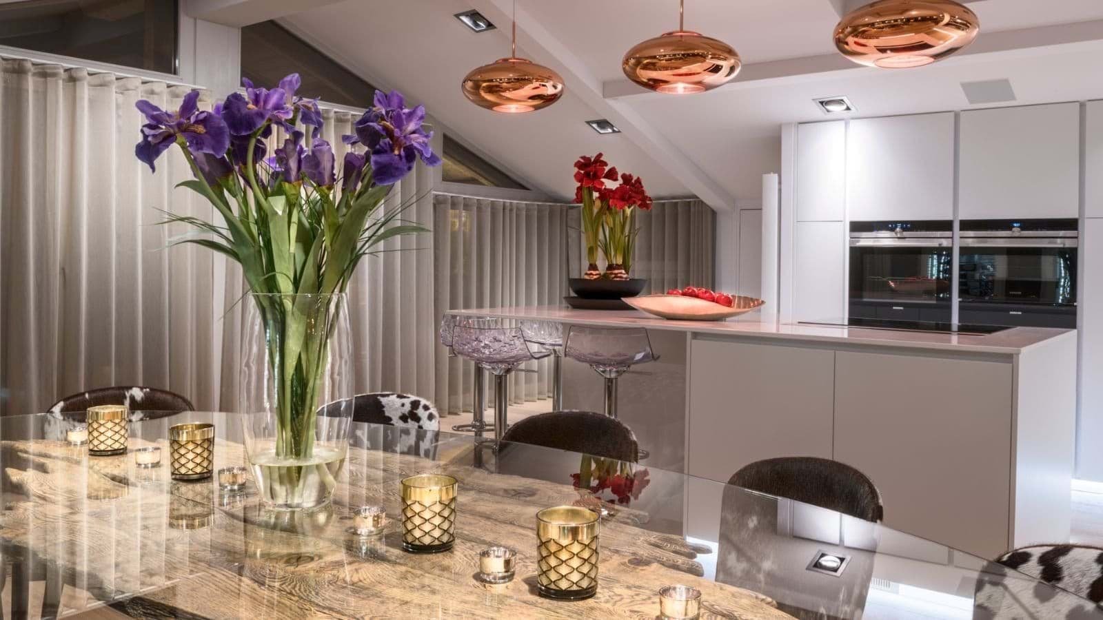 Kitchen with dual built-in ovens and island seating