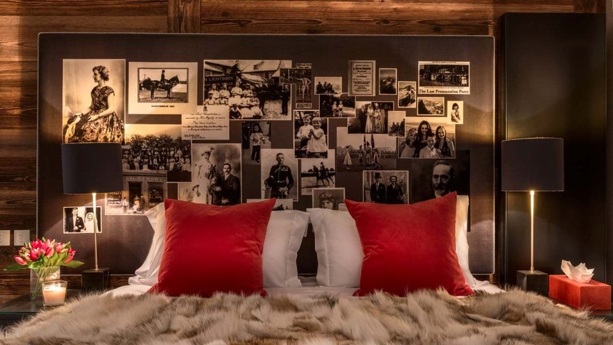 Bedroom featuring custom vintage photo collage headboard and wood paneling