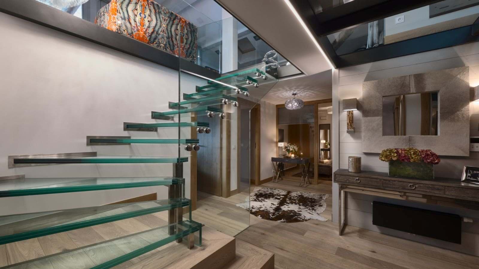Floating glass staircase with transparent upper level walkway