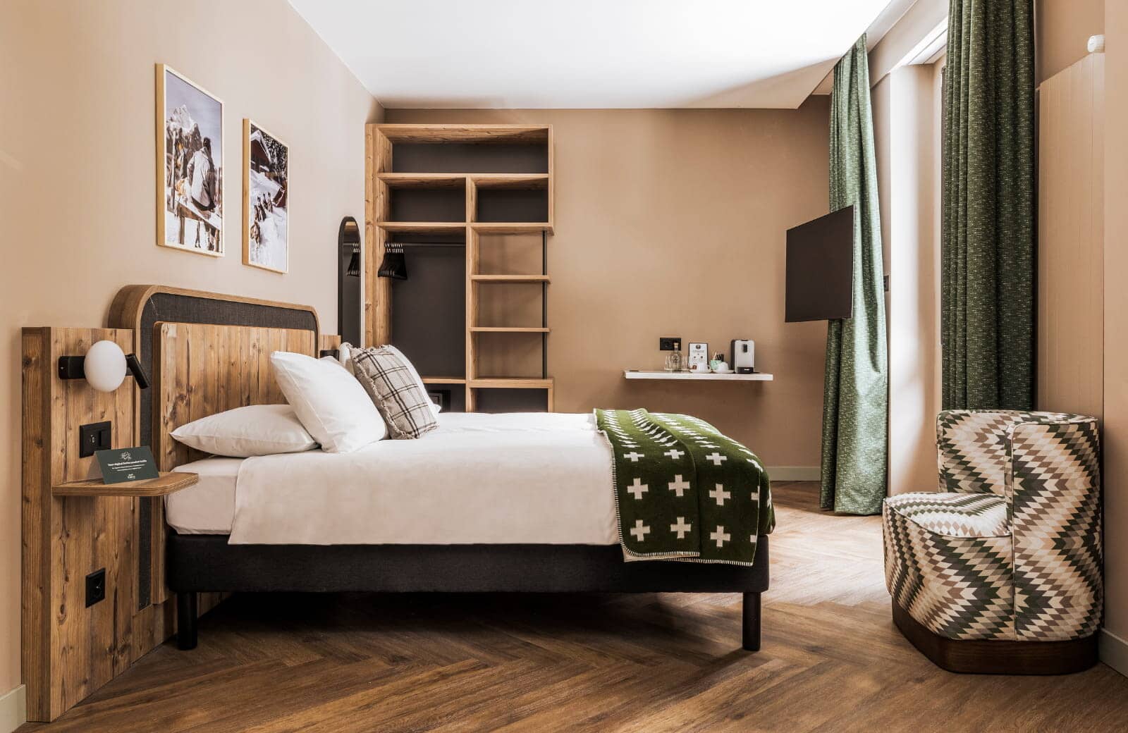 Guest bedroom with queen bed and open-shelving wardrobe storage