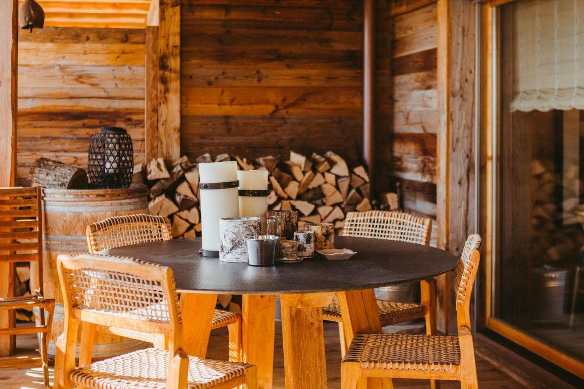 Covered patio with dining seating for 4 and firewood storage