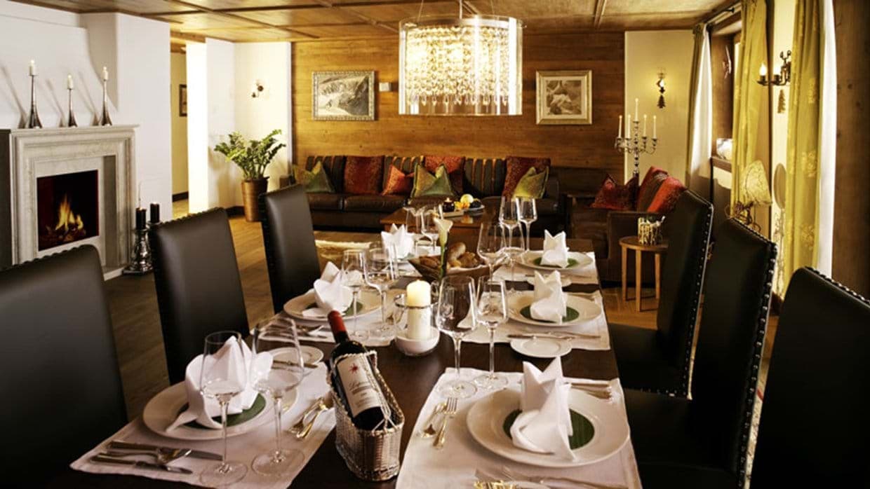 Dining area seats 8; adjacent living room with fireplace