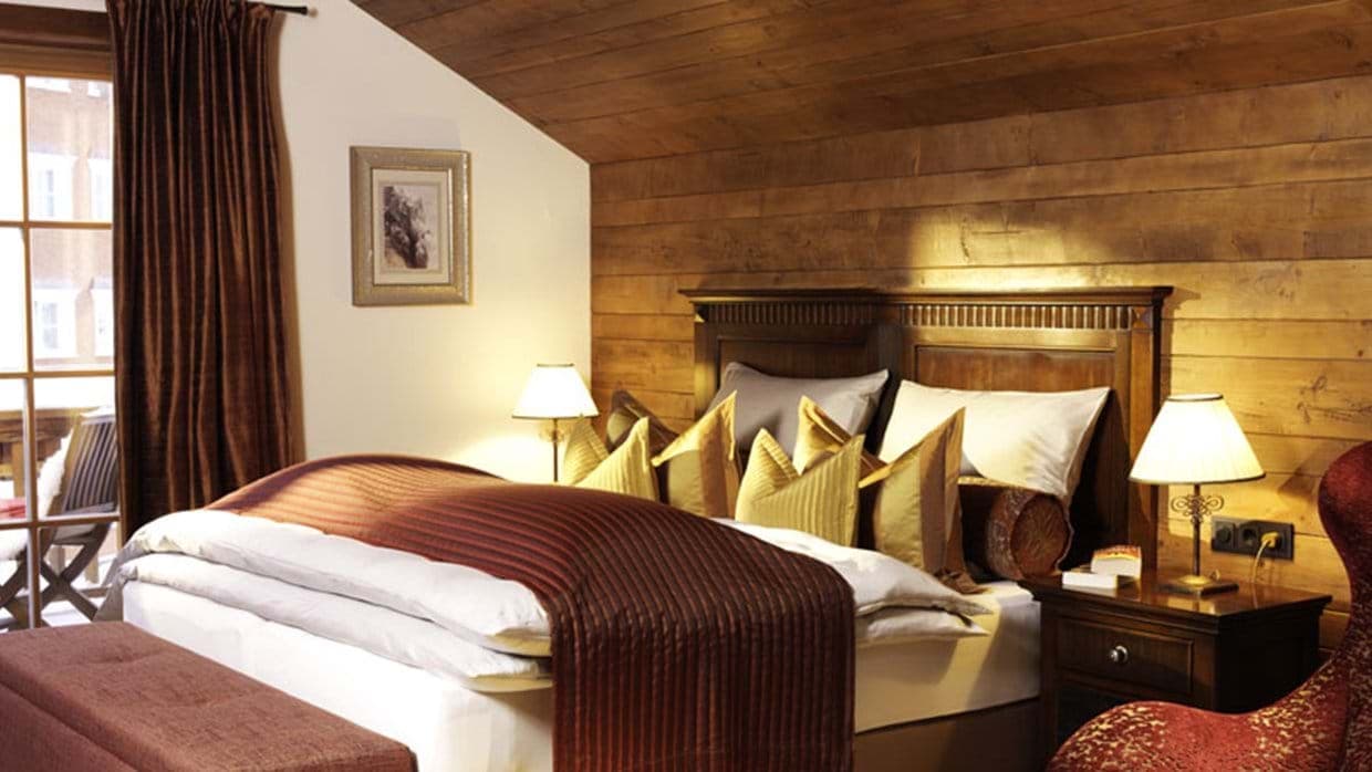 Bedroom with king bed and private balcony access