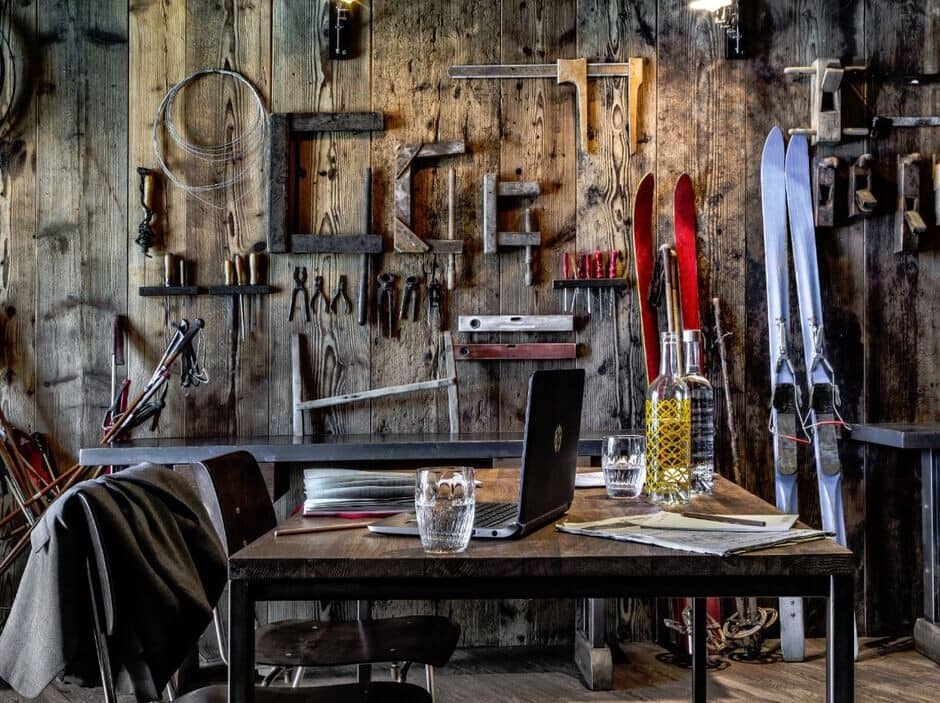 Dedicated workspace with vintage woodworking tools and ski decor