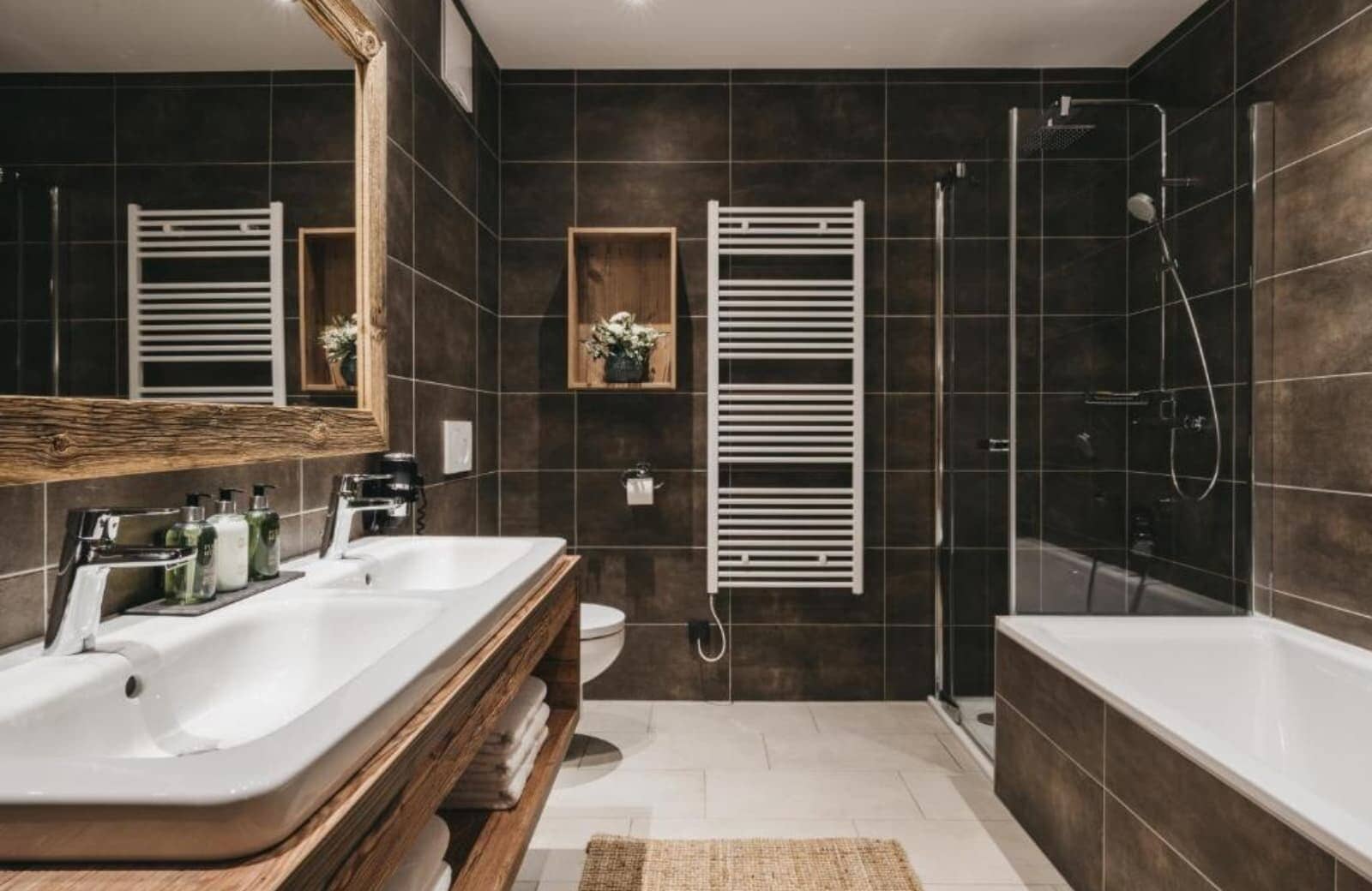 Bathroom with dual vanity and heated towel rail