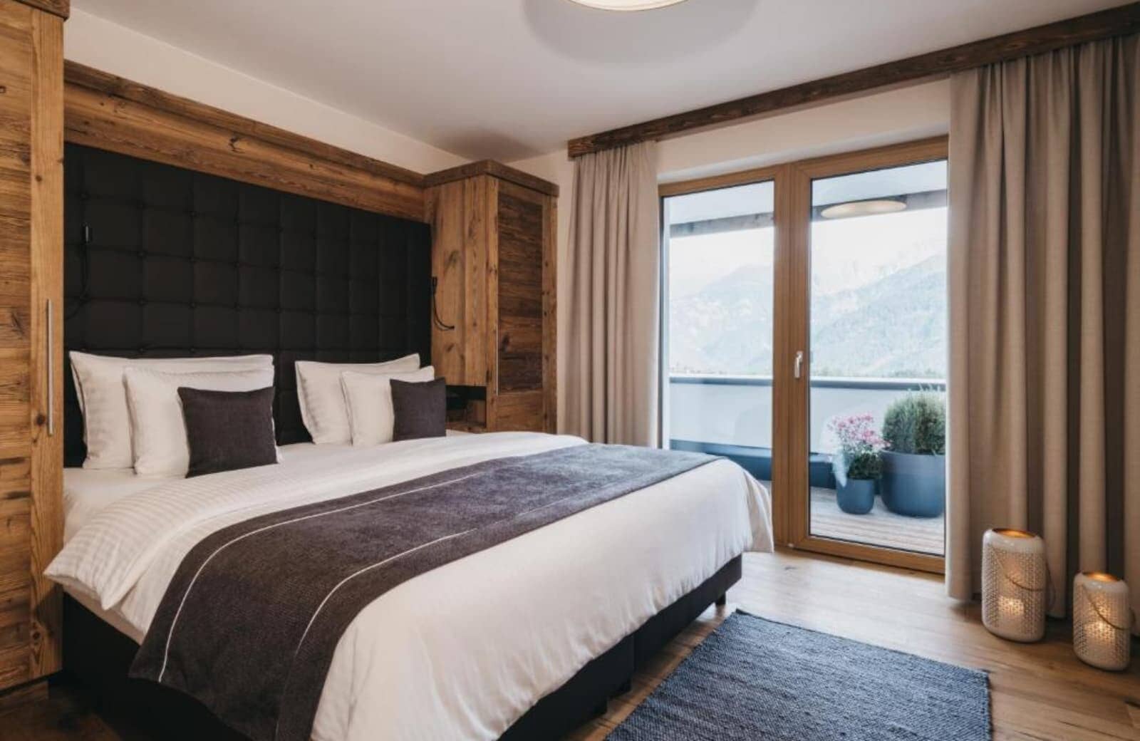 Bedroom with king bed and balcony access showing mountain views