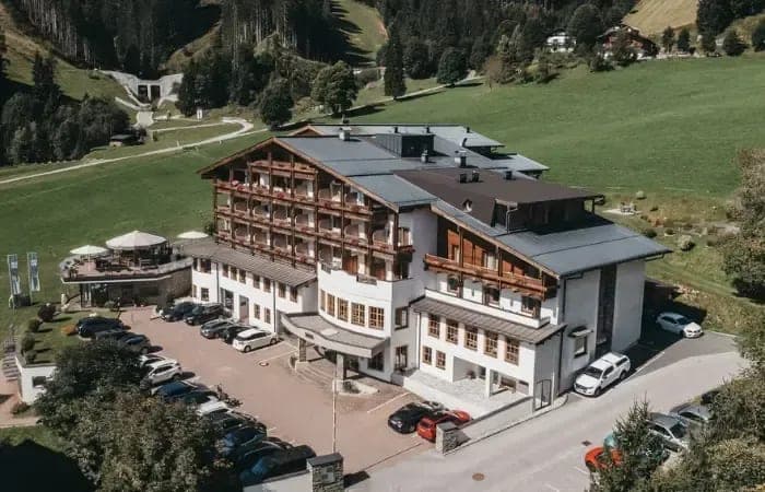 Aerial view showing onsite parking and direct access to mountain hiking trails