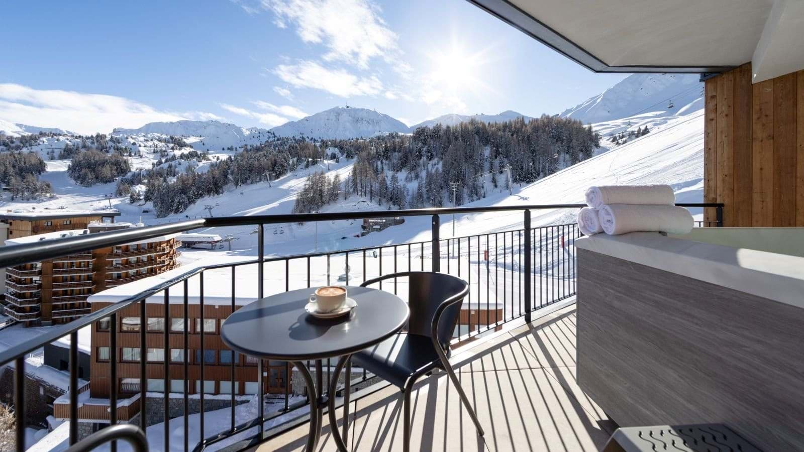 Private balcony with hot tub and direct ski slope views