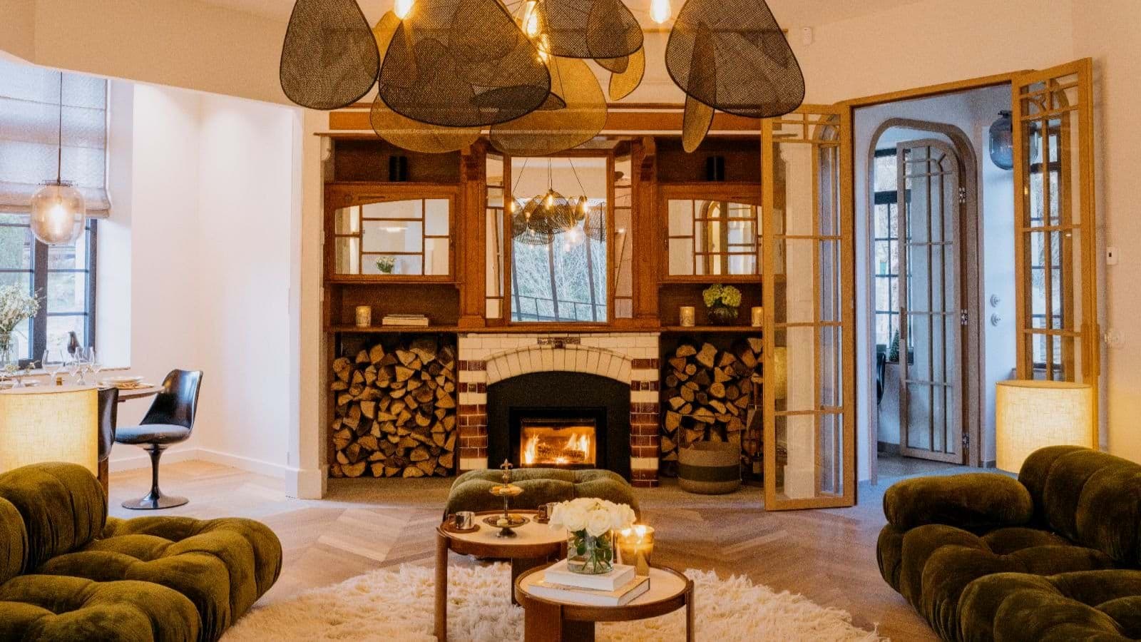 Living area with wood-burning fireplace and herringbone oak floors
