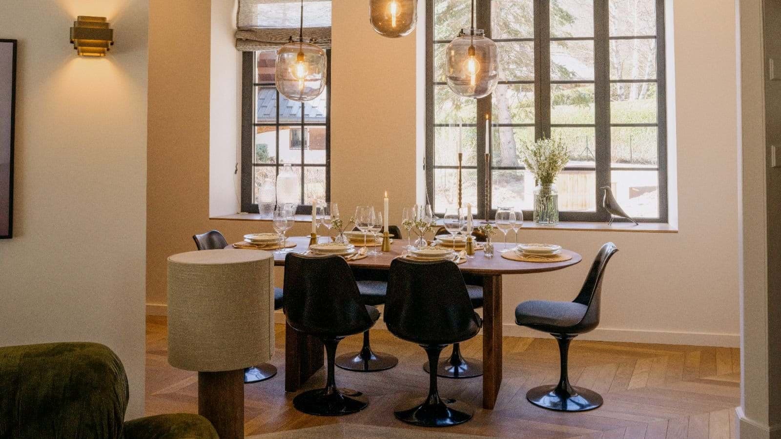 Dining area with seating for 6 and herringbone wood floors