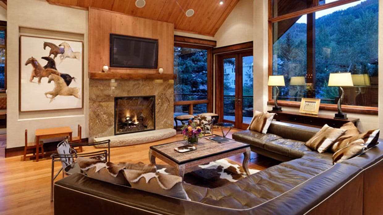 Living room with gas fireplace and leather sectional seating for 10