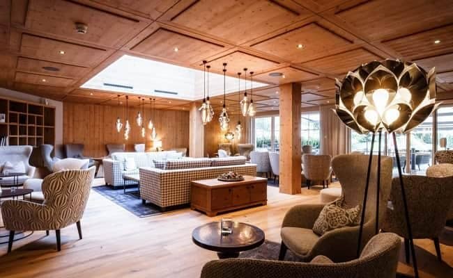 Lounge with wood-paneled ceiling, skylight, and seating for 20+