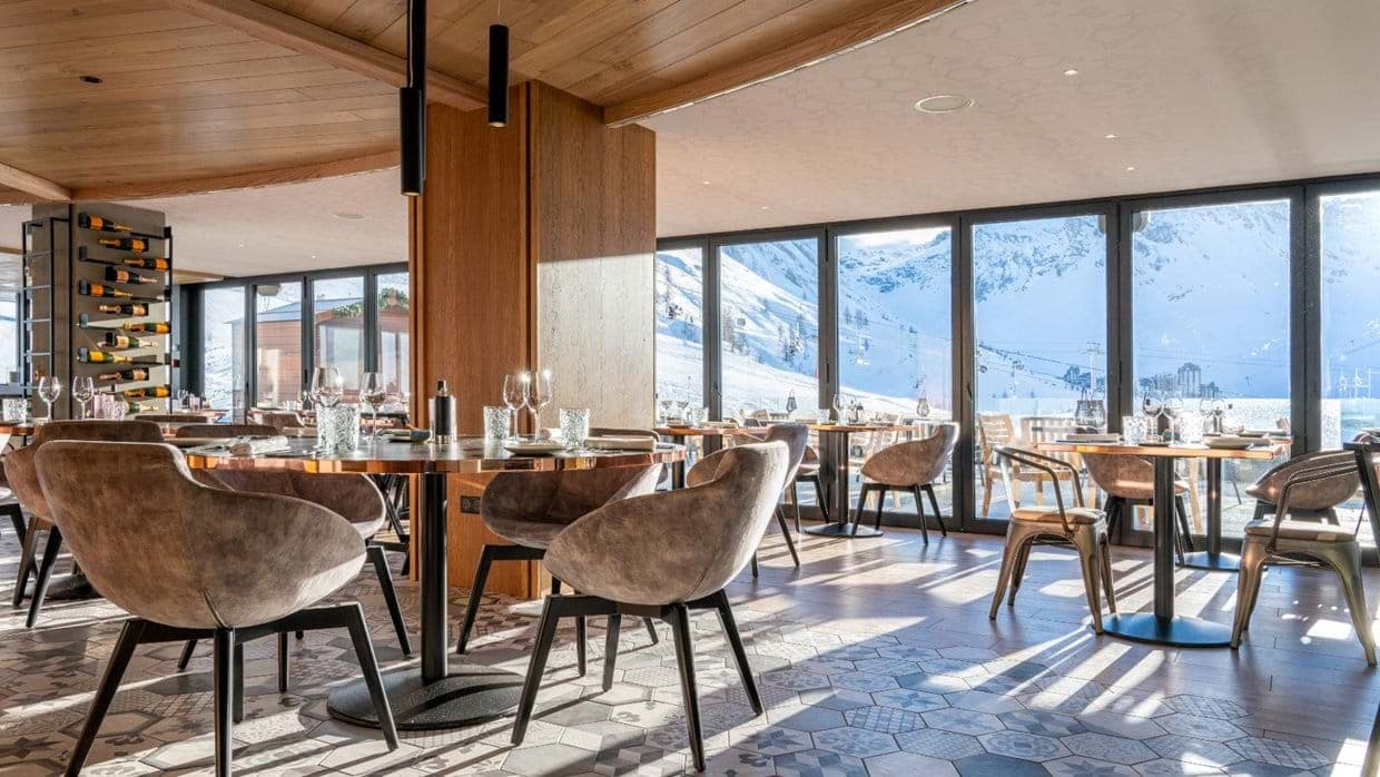 Dining area seats 8; panoramic mountain and valley views through floor-to-ceiling windows