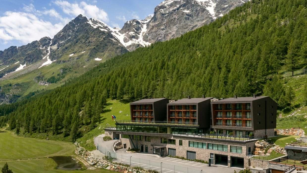 Lodge exterior featuring private balconies and on-site parking