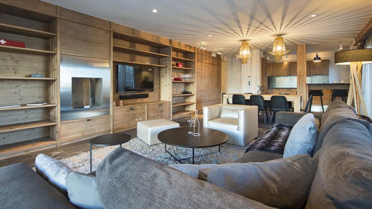 Open-plan living area with integrated gas fireplace and smart TV